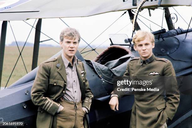 Actors Malcolm McDowell and Peter Firth pose for portraits during an interview on the set of the film, "Aces High," in Wycombe Air Park on September...