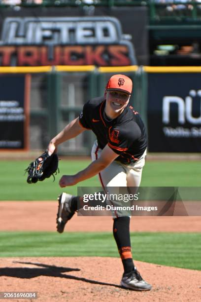 Kyle Harrison of the San Francisco Giants throws a pitch during the third inning of a spring training game against the Texas Rangers at Scottsdale...