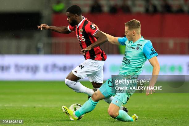 Nice's Ivorian French forward Jeremie Boga fights for the ball with Montpellier's Swiss defender Becir Omeragic during the French L1 football match...