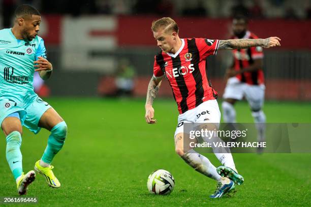 Nice's French defender Melvin Bard fights for the ball with Montpellier's French midfielder Arnaud Nordin during the French L1 football match between...