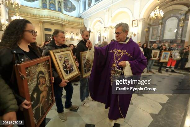March 07 Pagani, Salerno, Italy: Worshippers gather for the blessing of paintings of the Madonna del Carmine, known as 'Madonna delle Galline' that...