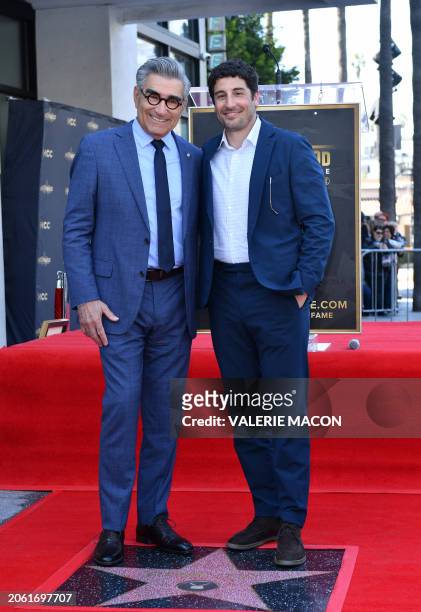 Canadian actor and comedian Eugene Levy poses with US actor Jason Biggs during a ceremony honoring Levy with a star on the Hollywood Walk of Fame in...