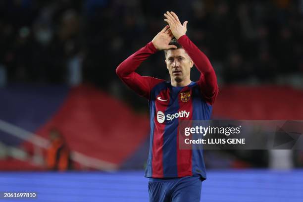 Barcelona's Polish forward Robert Lewandowski applauds at the end of the Spanish league football match between FC Barcelona and RCD Mallorca at the...