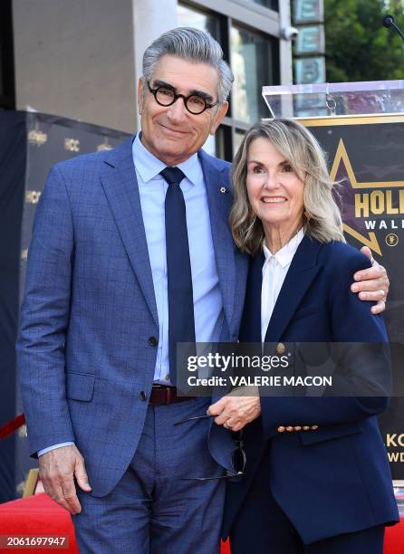 Canadian actor and comedian Eugene Levy poses with his wife Deborah Divine during a ceremony honoring Levy with a star on the Hollywood Walk of Fame...