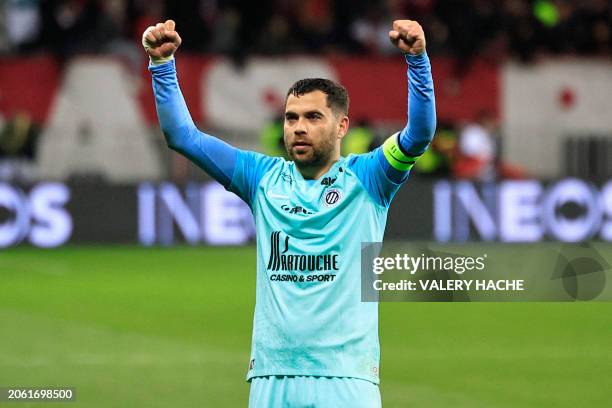 Montpellier's French midfielder Teji Savanier celebrates at the end of the French L1 football match between OGC Nice and Montpellier Herault SC at...