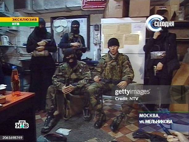 File picture of Russian television channel NTV showing the members of the Chechen rebel group and their leader Movsar Barayev speaking to the...