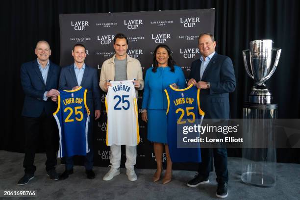 Roger Federer poses for a jersey swap photo with Laver Cup CEO Steve Zacks, Brandon Schneider of the Golden State Warriors, San Francisco Mayor...