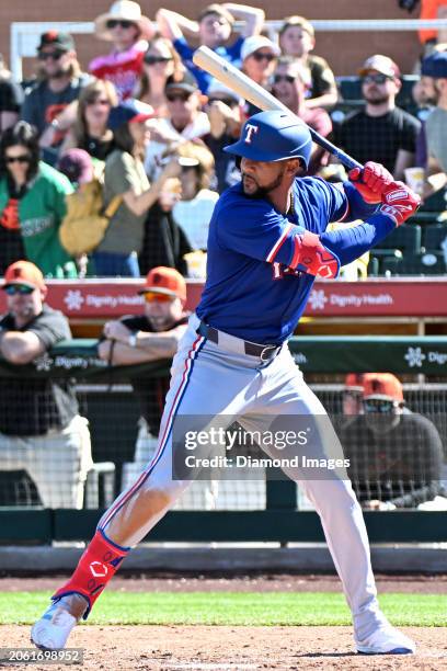 Leody Taveras of the Texas Rangers bats during the fifth inning of a spring training game against the San Francisco Giants at Scottsdale Stadium on...