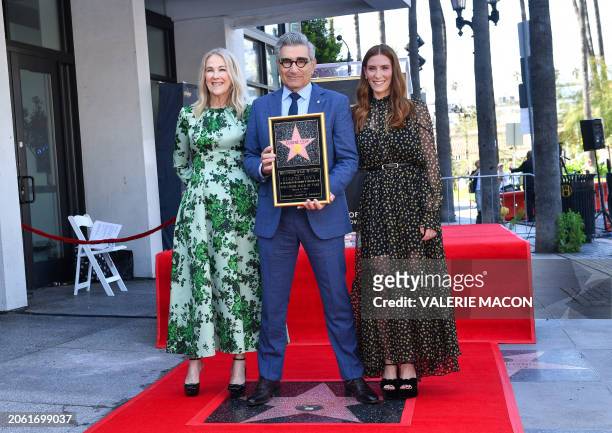 Canadian actor and comedian Eugene Levy poses with his daughter Canadian actress Sarah Levy and Canadian-US actress Catherine O'Hara during his...