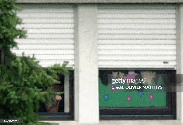 The hostage-taker shows up at the window of a day care in Wasserbillig, Luxembourg, Thursday 01 June 2000, while holding hostage still 26 children...