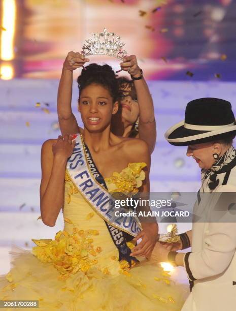 Chloe Mortaud, Miss Albigeois-Midi-Pyrenees, reacts as she is awarded Miss France 2009 during the 62nd Miss France beauty contest, on December 6,...