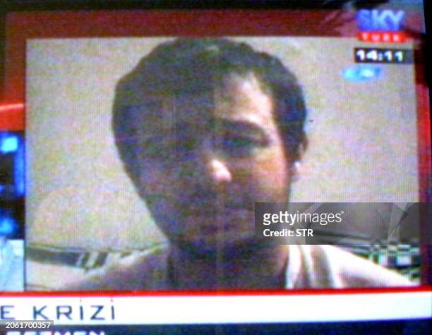 Picture taken from TV monitor 19 August 2004 shows Turkish Aytullah Gezmen who was taken hostage with his friend Murat Yuce who was killed in Iraq....