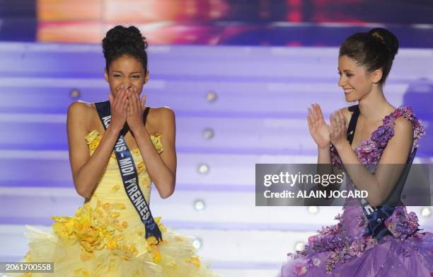 Chloe Mortaud, Miss Albigeois-Midi-Pyrenees , is applauded by her first runner-up Miss Lorraine Camille Cheyere after being awarded Miss France 2009...