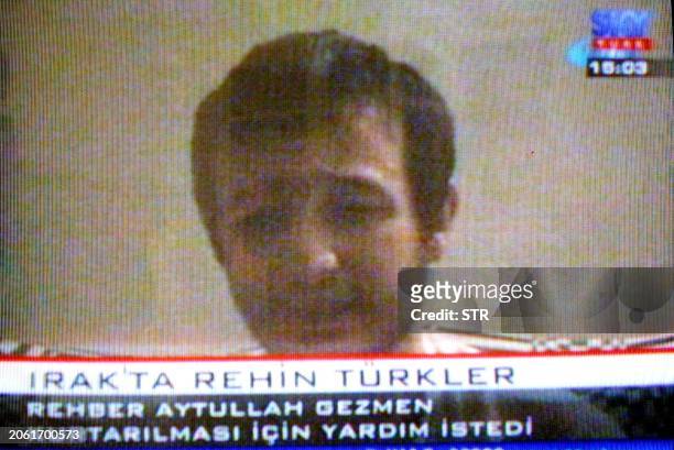 Picture taken from TV monitor 19 August 2004 shows Turkish Aytullah Gezmen who was taken hostage with his friend Murat Yuce who was killed in Iraq....