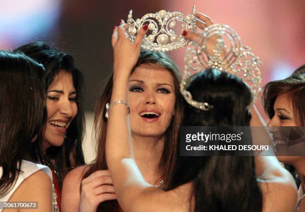 Ehsan Hatem is crowned Miss Egypt 2007 by last year's winner Fawzaya Mohamed at the end of the beauty pageant late 23 April 2007 in Cairo. Twenty...