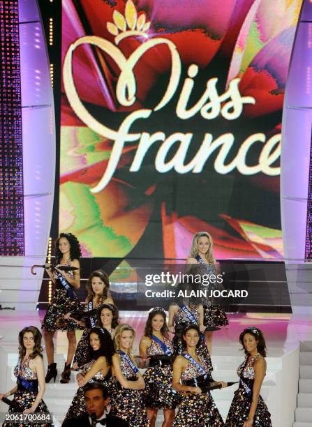 French TV host Jean-Pierre Foucault speaks next to contenders during the 62nd Miss France beauty contest, on December 6 2008 in Le Puy-du-Fou, west...