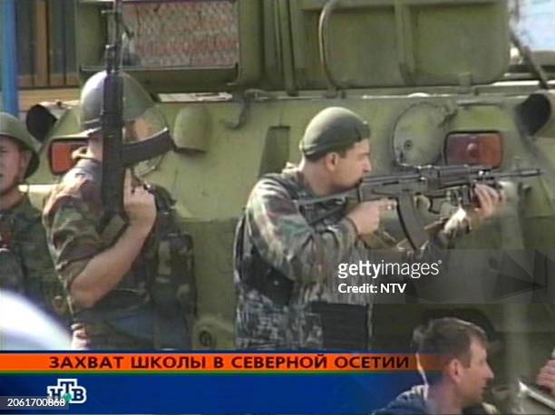 Grab taken from the Russian NTV channel 01 September 2004 shows Russian special police forces soldiers taking position during an operation in the...