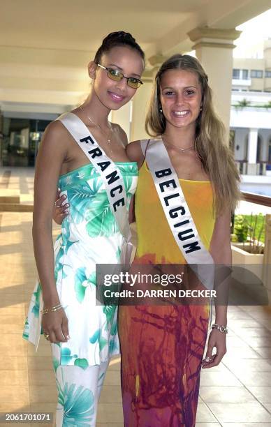 Sonia Rolland, Miss France 2000, and Joke Van de Velde, Miss Belgium 2000 pose near the pool of a five-star hotel in Nicosia 27 April 2000. Delegates...