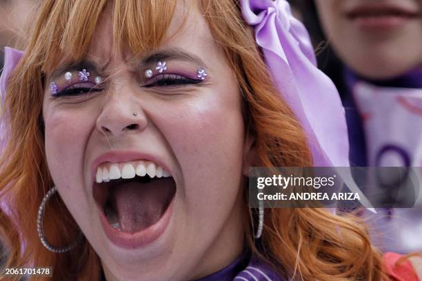 Demonstrator shouts slogans during a protest to mark International Women's Day in Bogota, on March 8, 2024. People around the world marked...