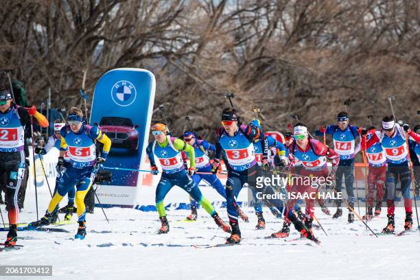 France's Fabien Claude sets off with other competitors at the start of the men's 4x7.5-km relay of the IBU Biathlon World Cup at Soldier Hollow...