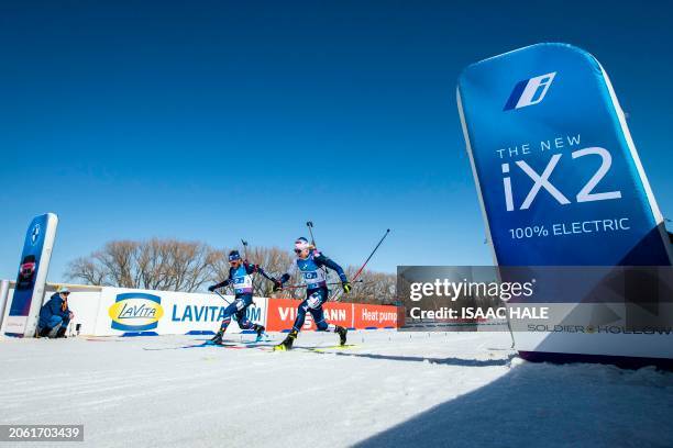 France's Antonin Guigonnat and Finland's Otto Invenius compete at the finish of the men's 4x7.5-km relay during the IBU Biathlon World Cup at Soldier...