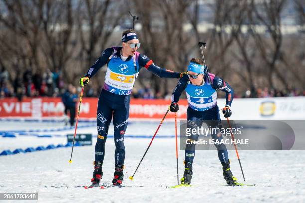 Italy's Didier Bionaz tags his teammate Lukas Hofer during the men's 4x7.5-km relay of the IBU Biathlon World Cup at Soldier Hollow Nordic Center in...