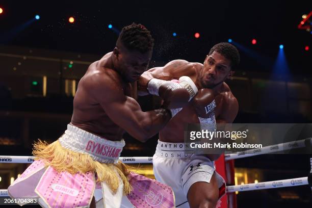 Anthony Joshua punches Francis N'Gannou during their Heavyweight Contest at Kingdom Arena on March 8, 2024 in Riyadh, Saudi Arabia.