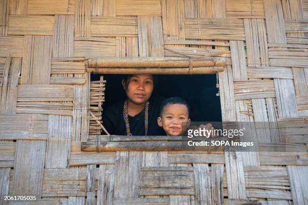 Mro woman poses for a portrait with her child. Mro people are an indigenous ethnic group in Bangladesh. They primarily inhabit the Chittagong Hill...