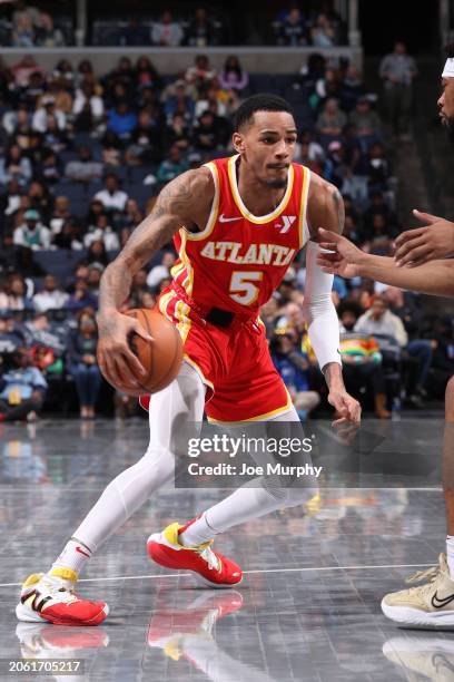 Dejounte Murray of the Atlanta Hawks dribbles the ball during the game against the Memphis Grizzlies on March 8, 2024 at FedExForum in Memphis,...