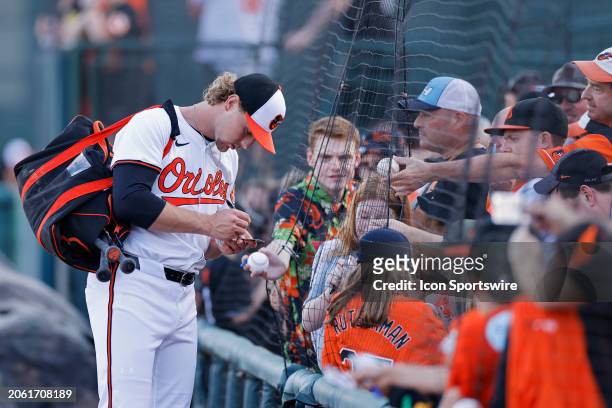 Baltimore Orioles shortstop Gunnar Henderson signs autographs for fans before an MLB spring training game against the Detroit Tigers on March 08,...