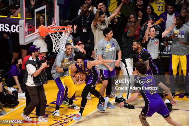 The Los Angeles Lakers celebrate Spencer Dinwiddie's game-winning block against Damian Lillard of the Milwaukee Bucks on March 8, 2024 at Crypto.Com...