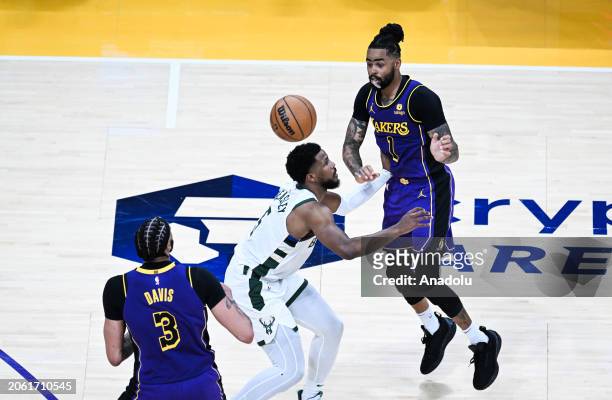 Malik Beasley of Milwaukee Bucks in action against D'Angelo Russell , Anthony Davis of Los Angeles Lakers during NBA game between Milwaukee Bucks and...