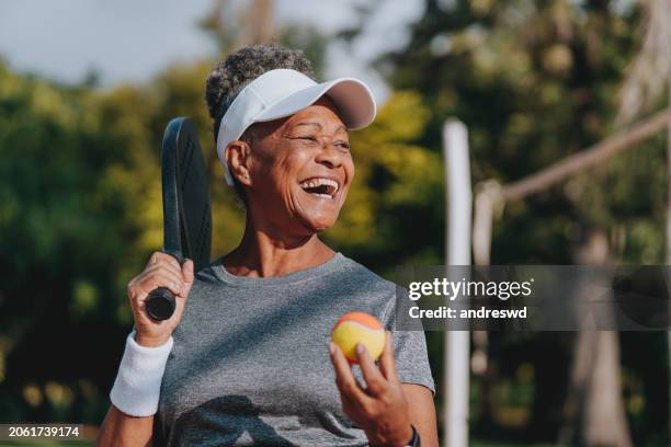 Portrait Senior Woman Beach Tennis, Stockfoto