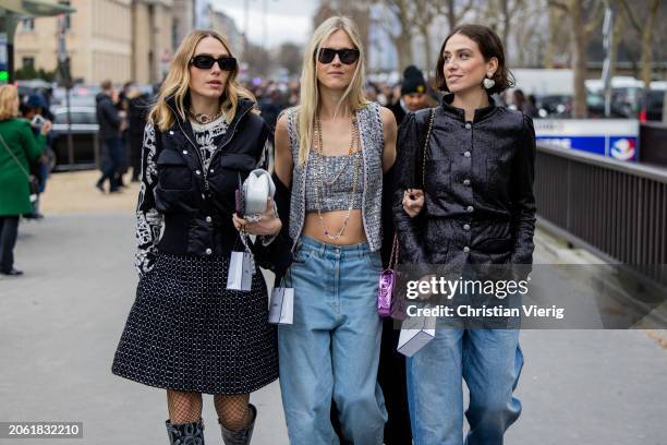 Chiara Baratello wears black skirt, vest, white bag & Linda Tol wears denim jeans, grey cropped top, vest & Erika Boldrin wears black jacket, denim...