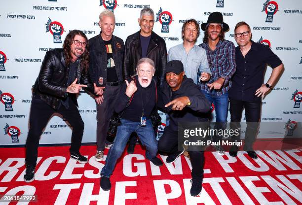 Dave Grohl, Josh Freese, Pat Smear, Chris Shiflett, Rami Jaffee and Nate Mendel of The Foo Fighters join photographer Henry Diltz and Chuck D at the...