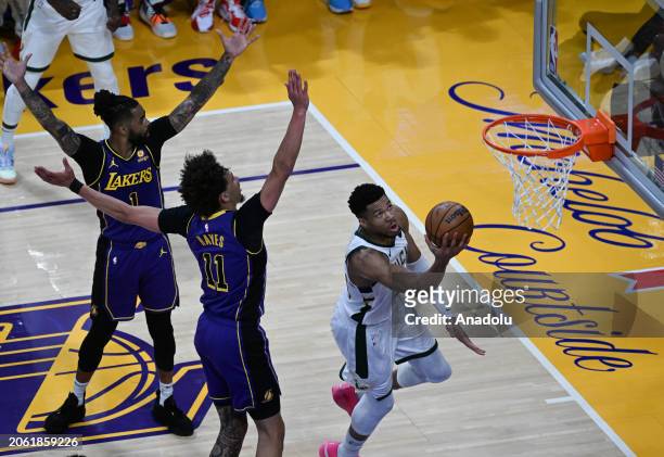 Giannis Antetokounmpo of Milwaukee Bucks in action against D'Angelo Russell , Jaxson Hayes of Los Angeles Lakers during NBA game between Milwaukee...