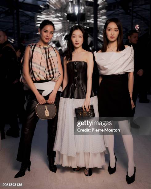 Urassaya Sperbund, Dongyu Zhou and Victoria Song attend the Louis Vuitton Womenswear Fall/Winter 2024-2025 show as part of Paris Fashion Week on...