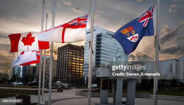 flags at half-mast in windsor, ontario - usmca stock pictures, royalty-free photos & images