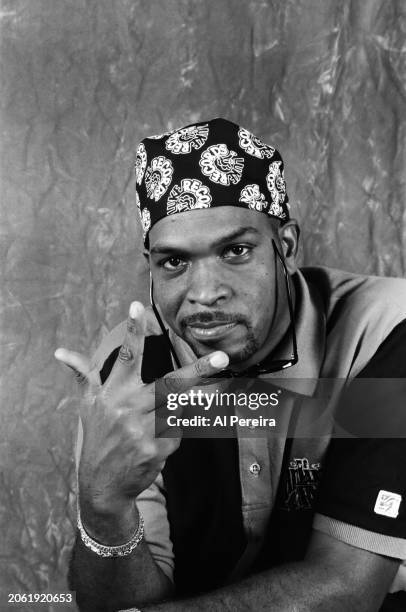 Rapper Luther Campbell of the group 2 Live Crew shows a peace sign gesture and wears a Miami Marlins polo shirt when he appears in a portrait taken...