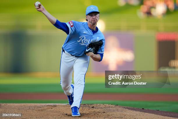 Brady Singer of the Kansas City Royals throws in the first inning during a spring training game against the Chicago Cubs at Surprise Stadium on March...