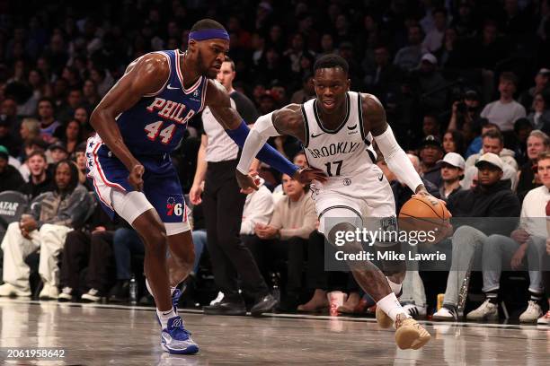 Dennis Schroder of the Brooklyn Nets drives to the basket against Paul Reed of the Philadelphia 76ers in the first half at Barclays Center on March...