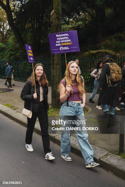 Participants are seen holding signs on the International Women s Day demonstration in Paris, capital of France on March 8, 2024. The event was...