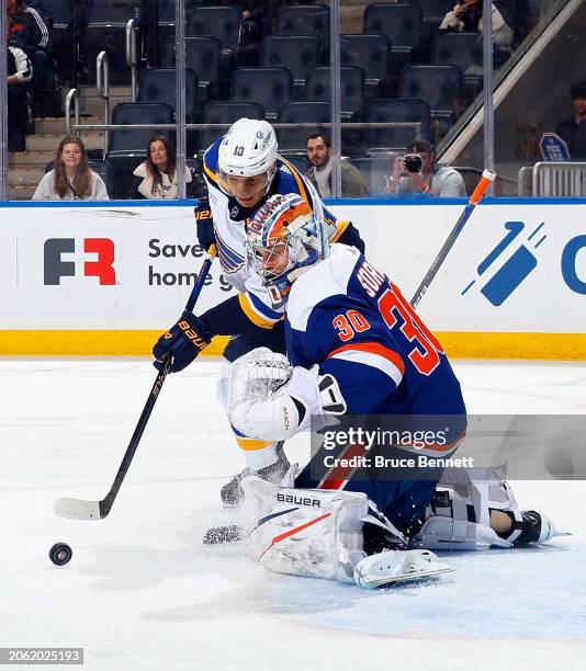 Brayden Schenn of the St. Louis Blues is stopped by Ilya Sorokin of the New York Islanders during the first period at UBS Arena on March 05, 2024 in...