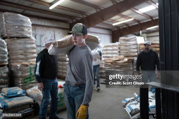 Volunteer helps load a truck with donated ranch supplies to help victims of the Smokehouse Creek fire on March 05, 2024 in Canadian, Texas. The fire...