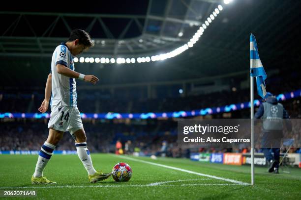Takefusa 'Take' Kubo of Real Sociedad prepares to take a corner kick during the UEFA Champions League 2023/24 round of 16 second leg match between...