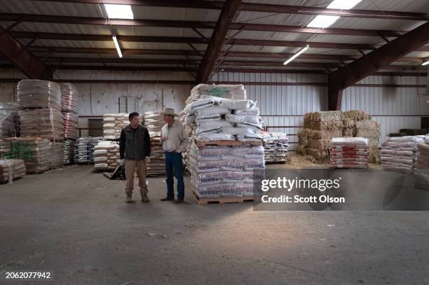 Volunteers distribute donated cattle feed and other ranch supplies to victims of the Smokehouse Creek fire on March 05, 2024 in Canadian, Texas. The...
