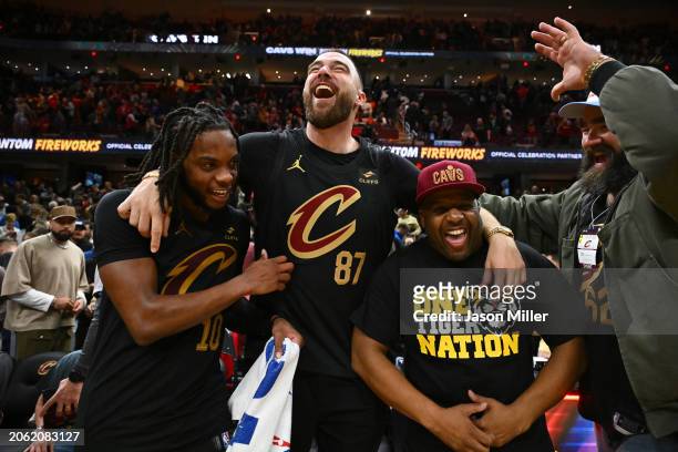 Darius Garland of the Cleveland Cavaliers celebrates with Travis Kelce, Ahmaad Crump and Jason Kelce after the Cavaliers defeated the Boston Celtics...
