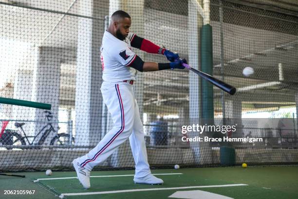 Carlos Santana of the Minnesota Twins bats during a workout prior to a spring training game against the Pittsburgh Pirates on February 24, 2024 at...