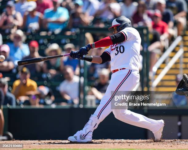 Carlos Santana of the Minnesota Twins bats during a spring training game against the Pittsburgh Pirates on February 24, 2024 at the Lee County Sports...