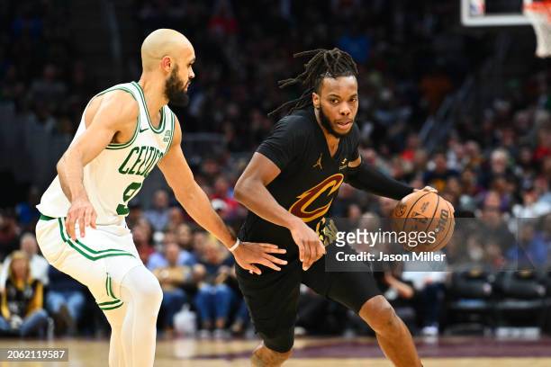 Derrick White of the Boston Celtics guards Darius Garland of the Cleveland Cavaliers during the third quarter at Rocket Mortgage Fieldhouse on March...